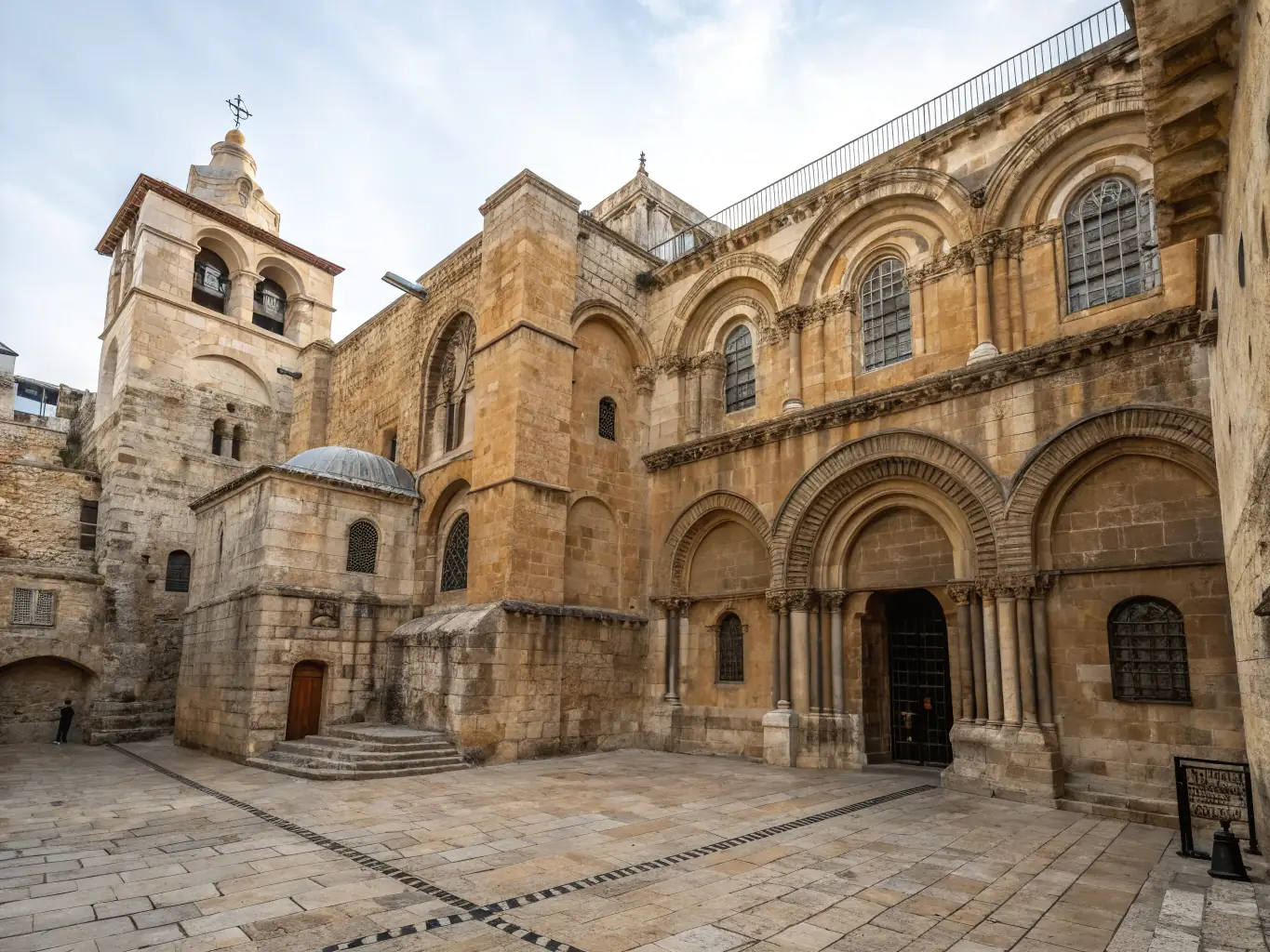 A panoramic view of the 'Jerusalem Through the Ages' exhibit, showcasing a multi-layered model of Jerusalem, with interactive projections illustrating the city's evolution from biblical times to the present day.